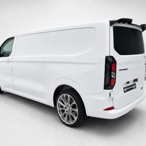 A-517_2jpg - OPSHOLDERS Rear three-quarter view of a white cargo van in a studio setting, with dark rear window and alloy wheels close-up.