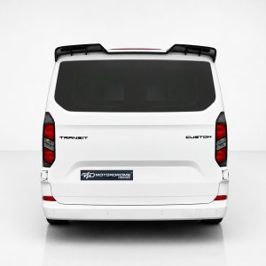 A-517_3jpg - OPSHOLDERS Rear view of a white van with tinted rear window, roof rack, and badges reading TRANSIT and CUSTOM; shows a vehicle design image.