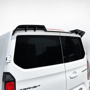 Rear three-quarter view of a white Ford Transit van with a black roof rack and dark rear windows