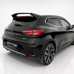A-520_2jpg - OPSHOLDERS Rear three-quarter view of a glossy black Mitsubishi SUV in a white studio, highlighting taillights and wheels.