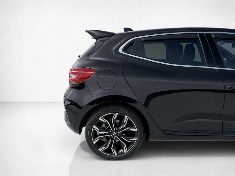A-520_6jpg - OPSHOLDERS Black SUV rear half with stylish alloy wheel and taillight, shown on a light background in a studio setting