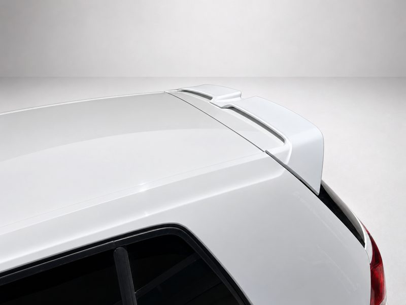 A-521_3jpg - OPSHOLDERS White car rear with a high-mounted spoiler and roofline—a sleek aerodynamic cargo-enhancing accessory on a SUV/CUV tailgate area
