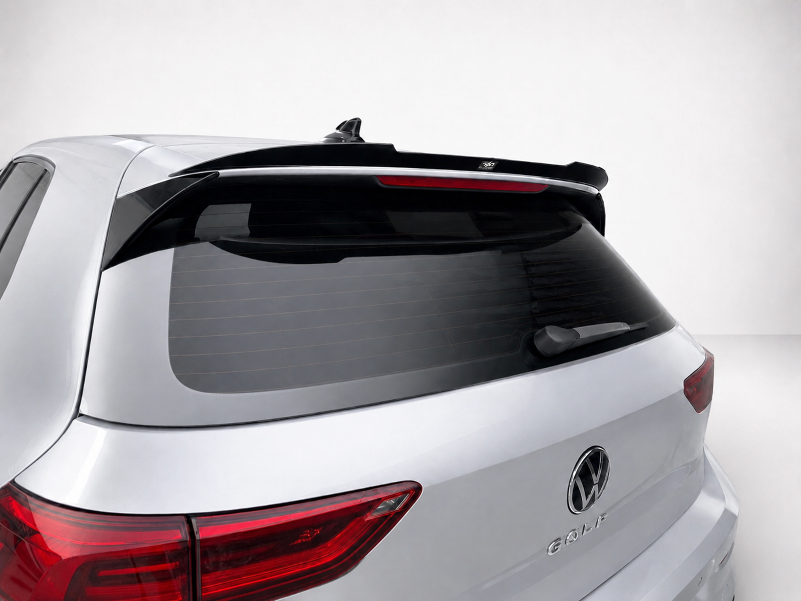 A-522_1jpg - OPSHOLDERS Rear view of a silver Volkswagen SUV showing tail lights, rear window, wiper and roof spoiler
