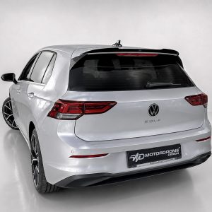 A-522_2jpg - OPSHOLDERS Rear view of a silver Volkswagen Golf wagon in a studio, showing taillights and large black alloy wheels.