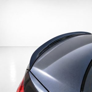 Close-up of the rear roofline of a metallic blue car, showing the curved window and glossy surface.