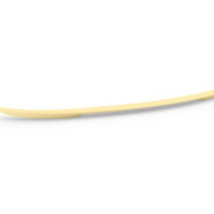 Long, pale yellow curved spatula lying on a white surface, with tapered ends.