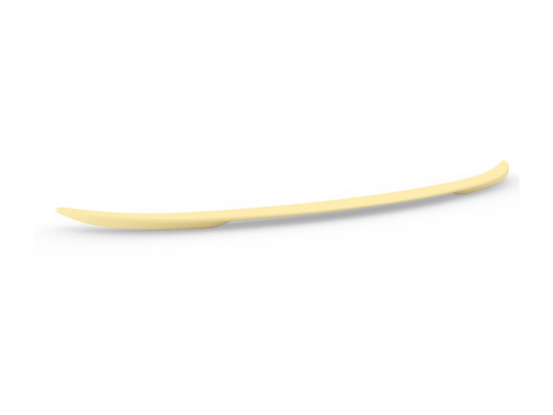 Long, pale yellow curved spatula lying on a white surface, with tapered ends.