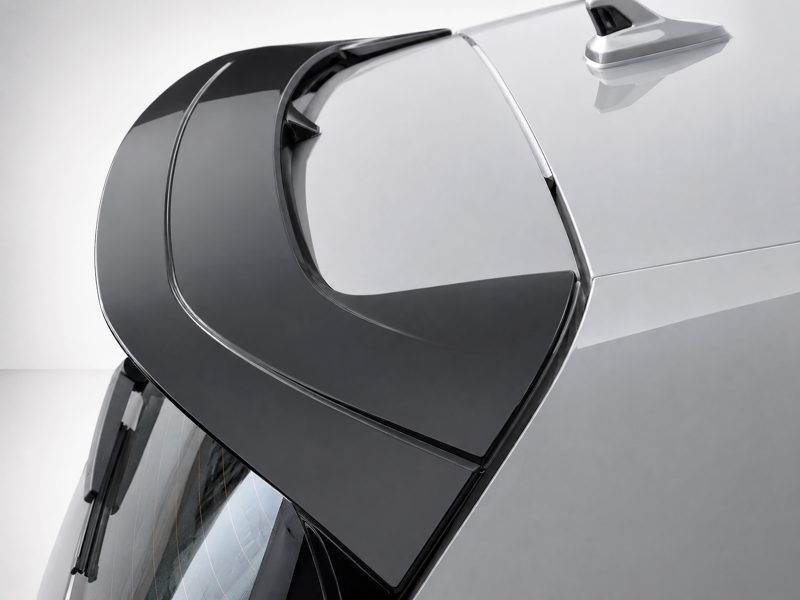 A-525_4jpg - OPSHOLDERS Close-up of a sleek car door with a large frameless window and glossy black panel.