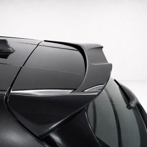 Close-up of a black sports car's rear spoiler and glossy roofline.