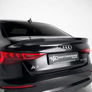 Rear view of a sleek black Audi A3, showing the taillights and trunk with a branded license plate reading MOTORDROME DESIGN