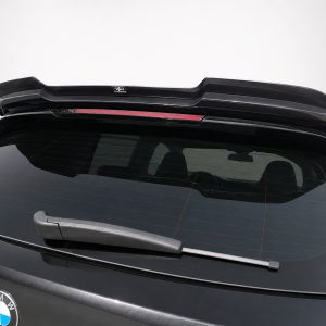 BMW rear hatch with a black roof spoiler mounted above the rear window on a sedan/SUV.