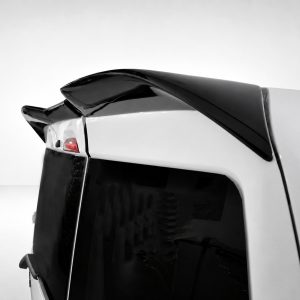 Rear view of a white SUV featuring a glossy black spoiler mounted on the rear hatch, with a dark rear window and red taillight visible on the left.