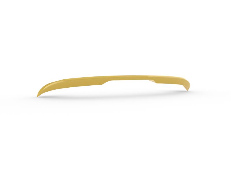 Yellow glossy curved plastic strip with a small central notch lying on a white surface.