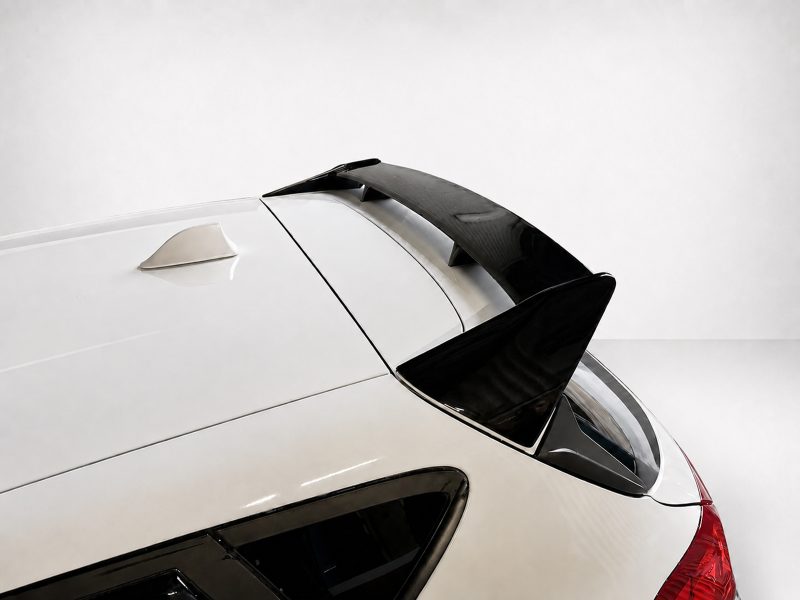 A-535_4jpg - OPSHOLDERS White car rear roof with a black spoiler above the rear window.