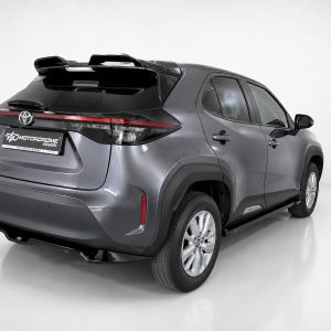 A-536_4jpg - OPSHOLDERS Gray Toyota RAV4 SUV viewed from the rear three-quarter angle, showing the roof spoiler, sleek taillights, and large alloy wheels in a bright studio setting.