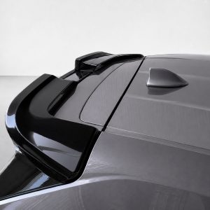 A-536_5jpg - OPSHOLDERS Close-up of a metallic gray car roof featuring a rear spoiler and integrated antenna.