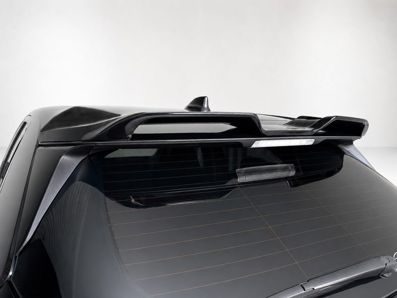 A-536_6jpg - OPSHOLDERS Rear upper view of a dark SUV showing a sleek roof spoiler and third brake light above the rear window.