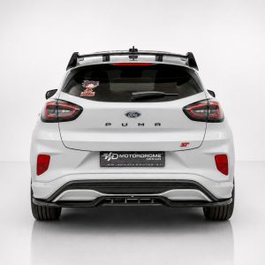A-538_3jpg - OPSHOLDERS Rear view of a white Ford Puma ST hatchback in a studio, showing the taillights, rear spoiler, and ST badge on the right side of the tailgate.