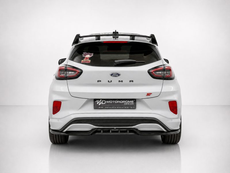A-538_3jpg - OPSHOLDERS Rear view of a white Ford Puma ST hatchback in a studio, showing the taillights, rear spoiler, and ST badge on the right side of the tailgate.