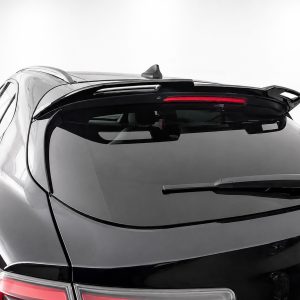 Rear view of a black hatchback car with roof spoiler, rear windshield wiper, and Alfa Romeo badge visible on the trunk.
