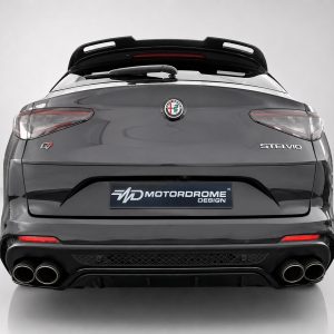 Rear view of a gray Alfa Romeo Stelvio with quad exhausts, spoiler, and MotorDrome Design plate visible on the bumper size.