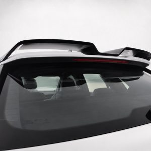 Rear view of a white SUV with a black roof spoiler and a red high-mounted brake light bar
