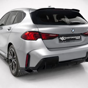 A-546_2jpg - OPSHOLDERS Rear three-quarter view of a silver BMW SUV with a black rear diffuser and prominent red taillights, displaying a MOTOR DROME license plate.