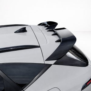 White sports car rear with a large black spoiler and dark-tinted windows.