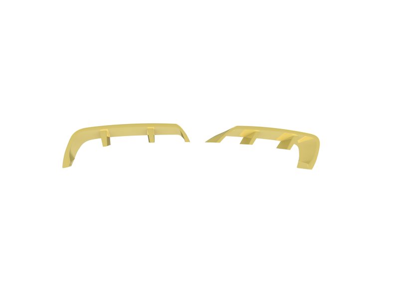 Two yellow curved plastic parts with rectangular supports laid apart on a white background