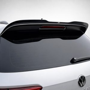 Rear of a silver Volkswagen SUV with a black roof spoiler and integrated third‑brake light on the tailgate.