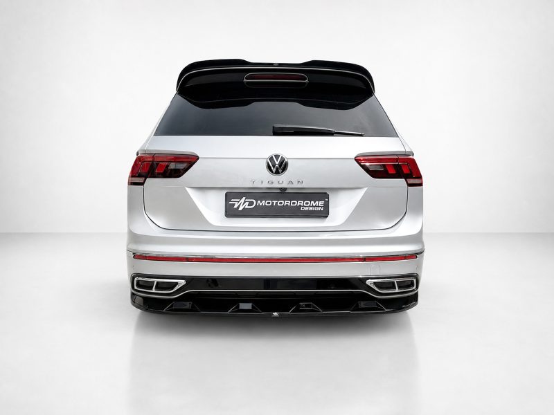 Rear view of a silver Volkswagen Tiguan SUV with a Motordrome Design license plate in a clean studio setting