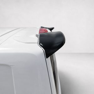 A-550_5jpg - OPSHOLDERS Rear of a white car with a small black spoiler mounted on the hatch above the tailgate.