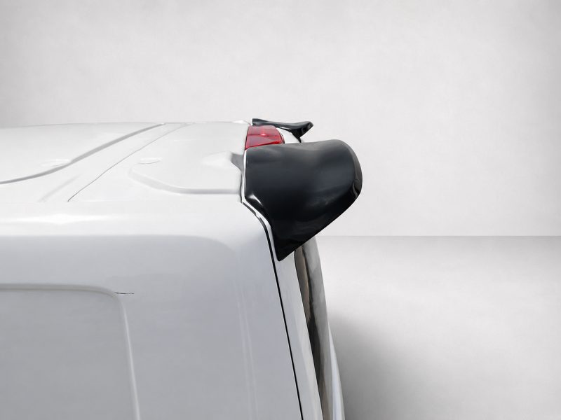 A-550_5jpg - OPSHOLDERS Rear of a white car with a small black spoiler mounted on the hatch above the tailgate.