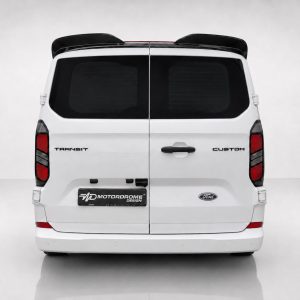 Rear view of a white Ford Transit Custom van in a studio setting, showing the split doors and rear lights on a clean backdrop.