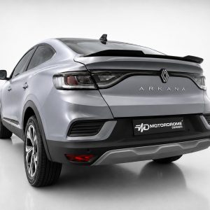 Rear three-quarter view of a silver Renault Arkana in a bright studio setting with a black rear bumper and spoiler, showing distinctive taillights.