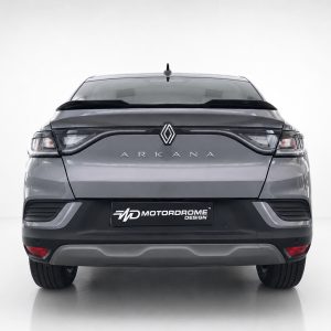Rear view of a silver Renault Arkana SUV in a studio, with a Motordrome Design plate on the bumper.