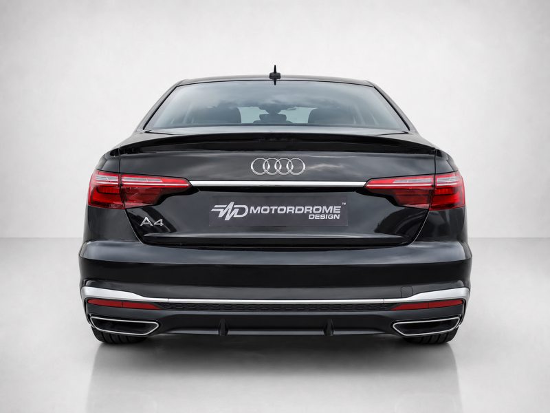A-556_3jpg - OPSHOLDERS Rear view of a black Audi A4 with Audi rings logo and a Motordrome Design plate on the trunk