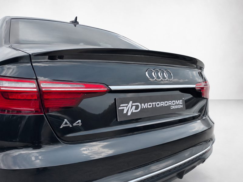 A-556_5jpg - OPSHOLDERS Rear view of a black Audi A4 showing LED taillights and a MotorDrome Design license plate.