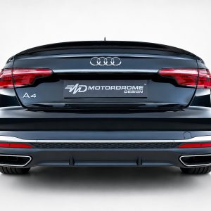 A-556_6jpg - OPSHOLDERS Rear view of a black Audi A4 with a Motordrome Design plate on the trunk lid.