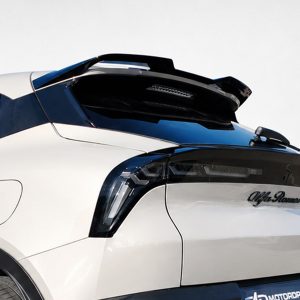 Close-up of a white truck cab showing a black raised spoiler on the roof and Alfa Romeo badge on the rear window area.