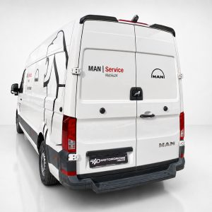 A-563_2jpg - OPSHOLDERS White MAN service van shown from rear-left, with 'MAN | Service Mobile24' branding on the back doors and a black rear bumper.