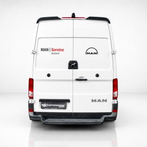 A-563_3jpg - OPSHOLDERS Rear view of a white MAN van with 'MAN Service' branding and 'Mobile24' on the left door, and the MAN logo on the right door.