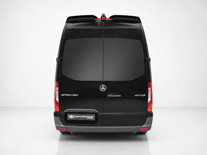 Rear view of a black Mercedes‑Benz Sprinter van with split rear doors and red taillights on a light backdrop.