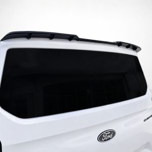 White Ford SUV rear view with dark-tinted window and roof spoiler on top edge of tailgate