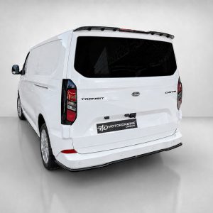 Rear three-quarter view of a white Ford Transit Custom van with dark rear window and visible taillights for back-view context.