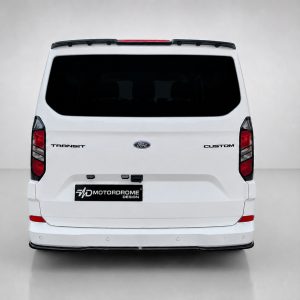 Rear view of a white Ford Transit Custom van with dark rear window and Motordrome Design plate on the bumper
