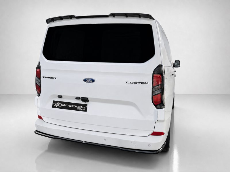 Rear view of a white Ford Transit Custom van with a dark rear window and roof rack on a light studio backdrop.