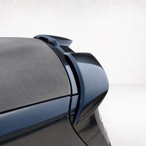 Close-up of a dark blue car trunk with an aerodynamic rear spoiler.