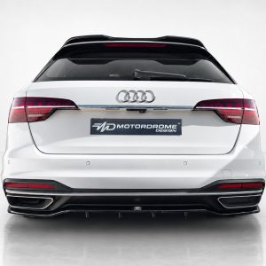 Rear view of a white Audi SUV with dual exhausts and a Motordrome Design license plate panel visible in the center.