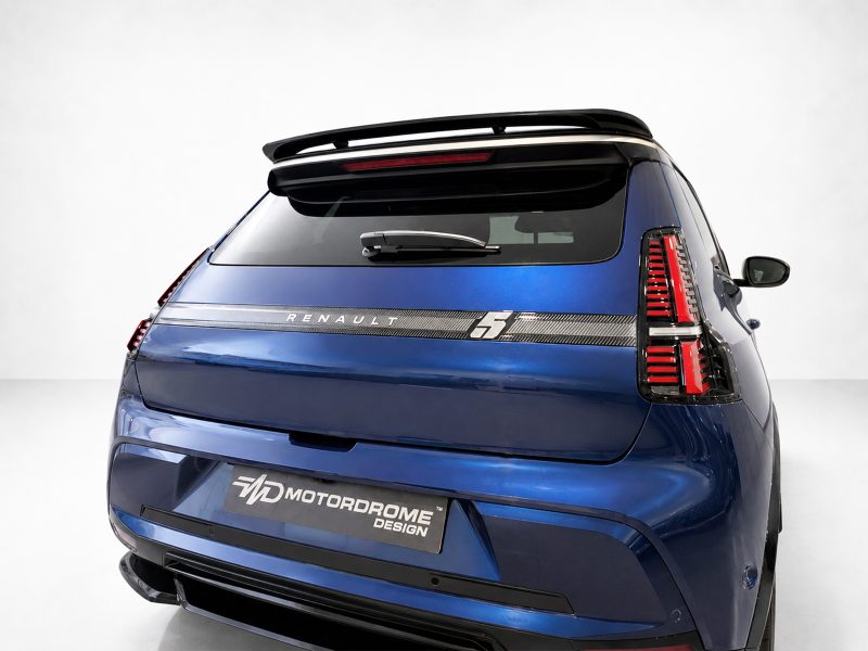 Rear view of a blue Renault SUV with a large rear spoiler and vertical red taillights.